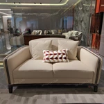 Cream Leather Sofa Set with Wave Quilted Craftsmanship, Natural Wood Veneer & Embroidered Wing Logo Accents